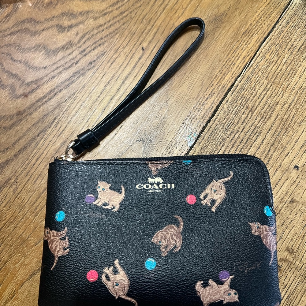 Coach Black Wristlet with Playful Cat Design